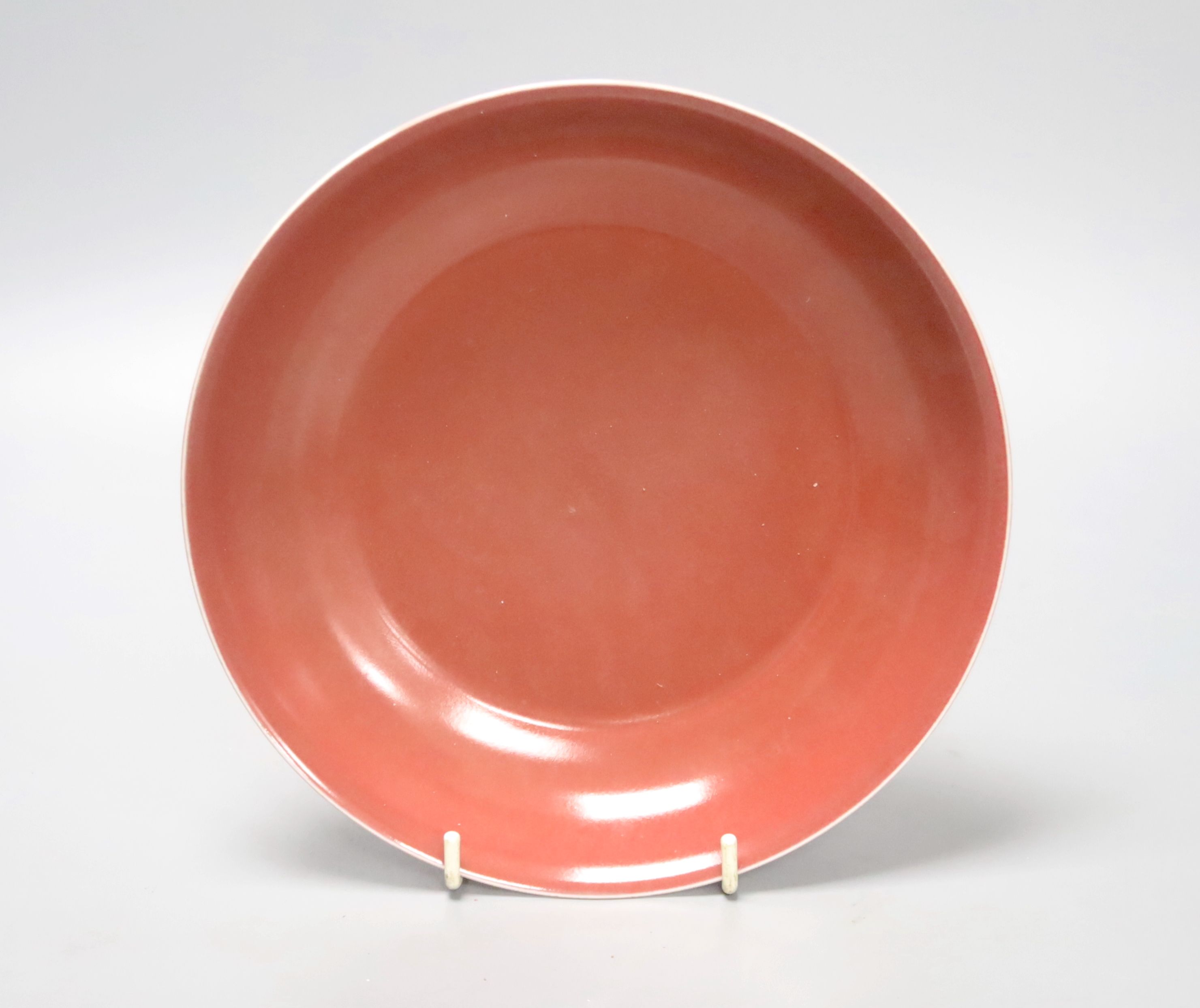 A Chinese Sang de Boeuf footed bowl, Qianlong seal mark to underside, 21cm diameter 5cm high